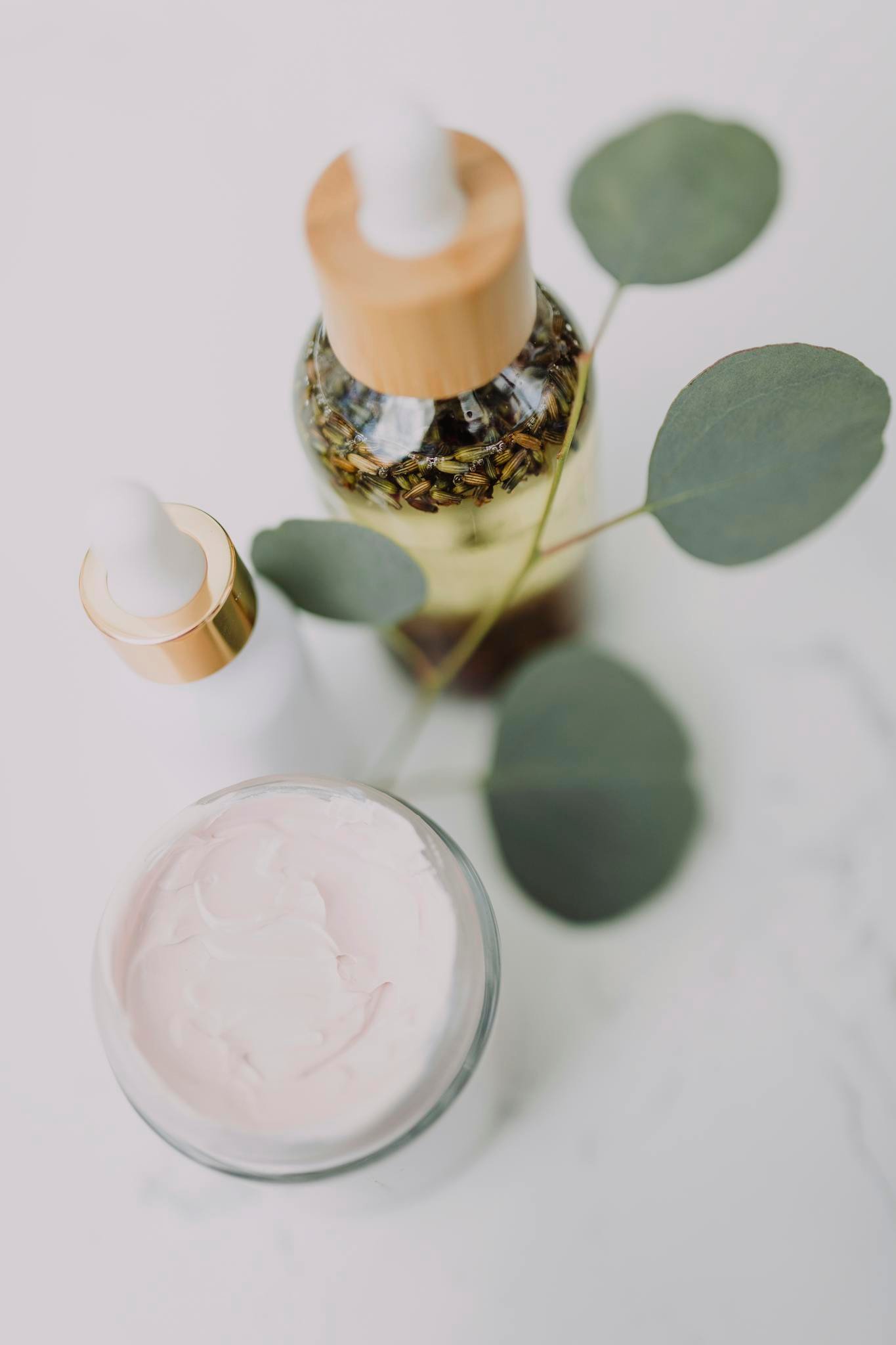 White and Brown Bottle on White Table